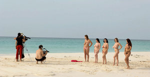 18 year old female Doris G slips off her underwear to pose naked on her bed